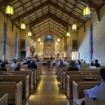 Interior of Epiphany Seattle sanctuary with choir stalls and altar area where weekly Evensong services take place