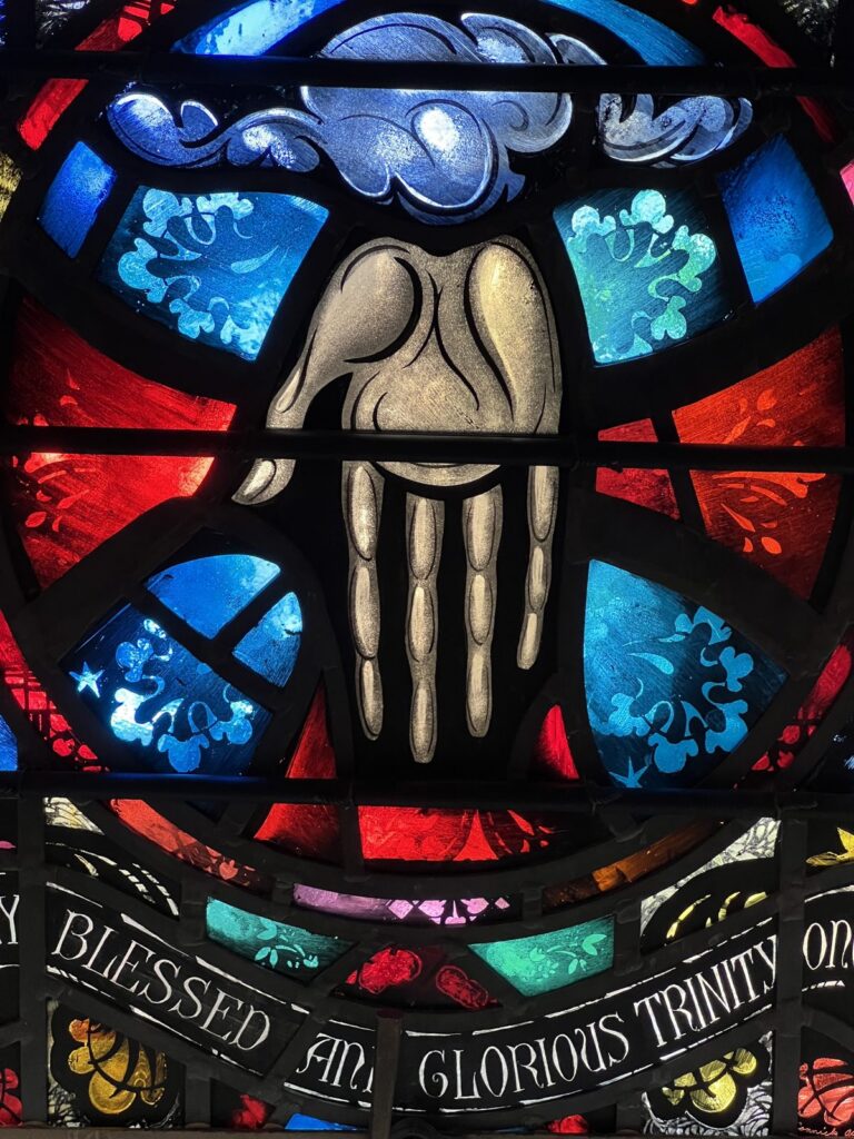 The hand of God the Father in stained glass, Trinity window, Epiphany Seattle
